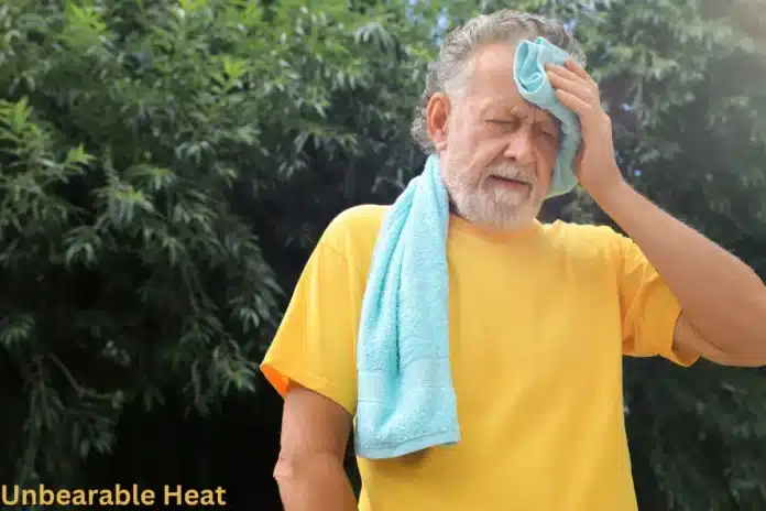 a man with a towel on his head in scorching heat