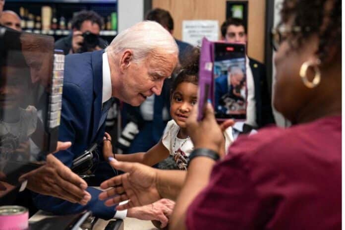 U.S. President Joe Biden (C-L) greets a young girl during a visit to Mario’s Westside Market grocery store in Las Vegas, Nevada, on July 16, 2024. | Photo Credit: AFP