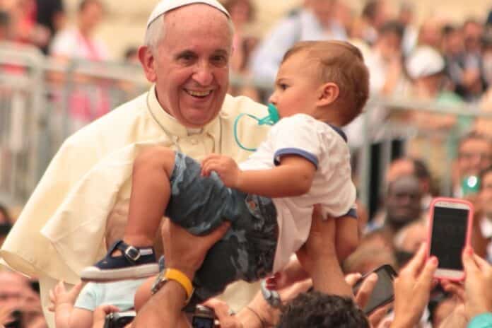 Pope Francis Holding and Blessing the Child